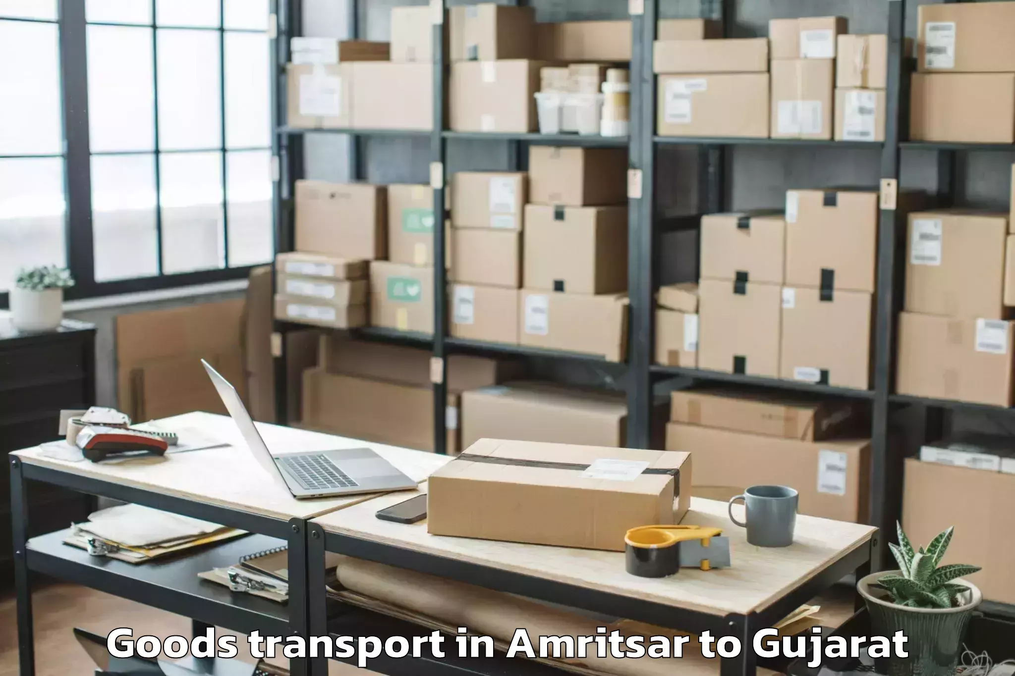 Book Amritsar to Crystal Mall Rajkot Goods Transport Online